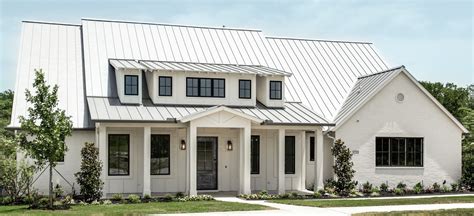 white house with metal building|houses with white metal roofs.